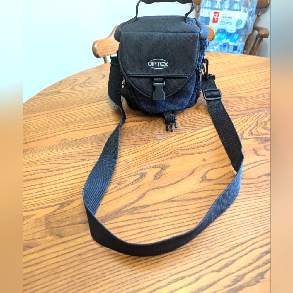 Optex Camera case.  7x4 and 7 high. Adjustable strap. Padded. Lots of po…